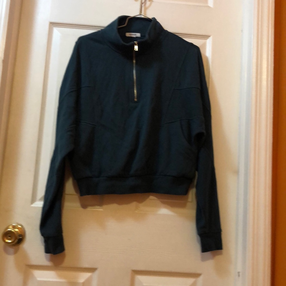 Garage jacket size medium in green, long sleeves. In good used condition.